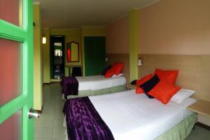 Rúm í herbergi á Hosteria Canoa