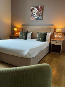 Postel nebo postele na pokoji v ubytování Cit'Hotel Le Louvre Orange + 37 fotografií