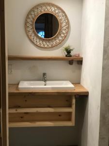a bathroom with a sink and a mirror at Vangeled Gaard B&B - Apartments in Holtug +99 photos