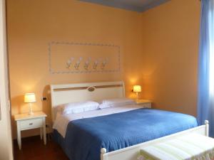A bed or beds in a room at Locanda Fuoriporta