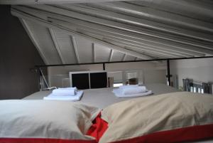 En eller flere senge i et værelse på La Terrazza dell’ODEON