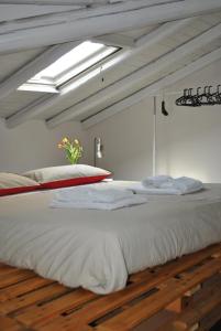 En eller flere senge i et værelse på La Terrazza dell’ODEON + 30 billeder