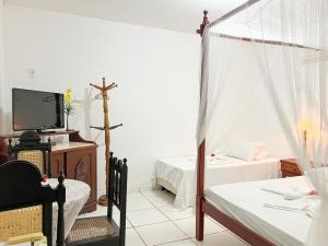 Postel nebo postele na pokoji v ubytování Pousada dos Candeeiros
