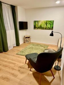TV a/nebo společenská místnost v ubytování bloom - Zentral, modern, großzügig für 1-6 Pers