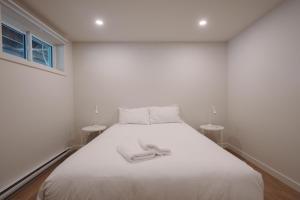 Cama o camas de una habitación en Chalets OST Shefford FORFAIT GROUPE