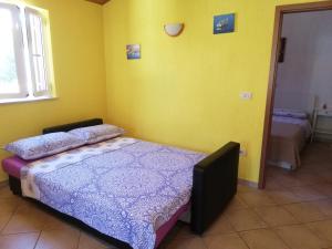 Postel nebo postele na pokoji v ubytování Apartments Renata - Brseč