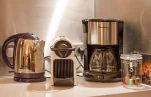 a kitchen counter with a coffee maker and a blender at appartement centre historique in Bordeaux