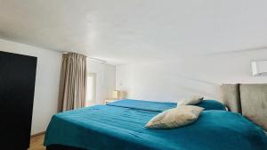 En eller flere senge i et værelse på Appartement Libeccio 22 LUMIO