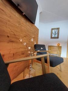 a dining room with two chairs and a table at Stay Novy in Bach