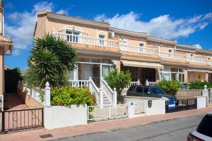 a large house with a balcony on a street at CH Limonero Doña Pepa in Rojales