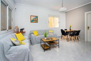 a living room with a couch and a table at CH Limonero Doña Pepa in Rojales