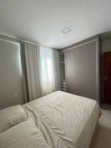 Ένα ή περισσότερα κρεβάτια σε δωμάτιο στο Apartamento 402