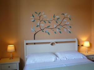 A bed or beds in a room at Locanda Fuoriporta