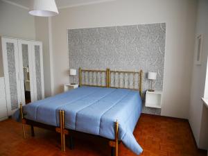 Postel nebo postele na pokoji v ubytování Primula Pianezza