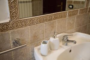 Koupelna v ubytování Salomonio hill + 50 fotografií