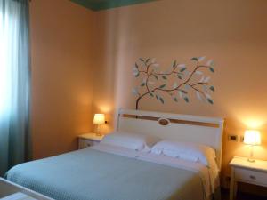 A bed or beds in a room at Locanda Fuoriporta