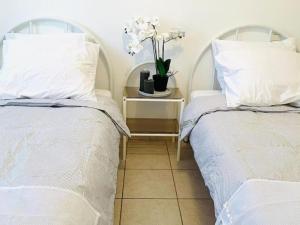 Postel nebo postele na pokoji v ubytování Rodger villa