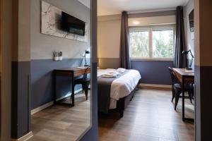 TV a/nebo společenská místnost v ubytování Scheppers Hotel