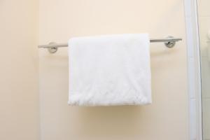 a towel hanging on a towel rack in a bathroom at Scandinavian City Centre Apartment in Worcester