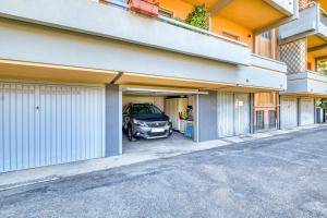 a car parked in the garage of a building at Casa Mediterraneo on the beach - Sea View, Garage, Wi-Fi, Air Conditioning in Bordighera