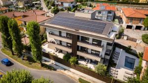 an image of a house with solar panels on the roof at Stemor Visionary Apartments in Desenzano del Garda