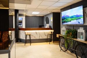 TV a/nebo společenská místnost v ubytování Scheppers Hotel