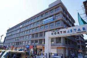 a large building with a northstar sign in front of it at City Dormitory in Ahmedabad +17 photos