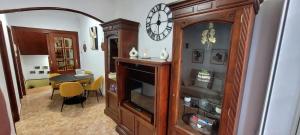 a living room with a clock on a wall at Apartamento Casa Gloria in Pontevedra