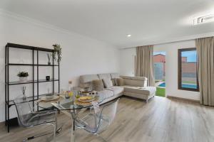a living room with a couch and a table at Hermosa Vista Tejina in Guía de Isora