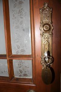 a wooden door with a knocker on it at Haus Gründerzeit in Görlitz