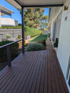 a deck with a view of a yard at Southern Comfortable in Goolwa North
