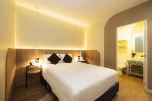 Tempat tidur dalam kamar di Hotel Solec Piura