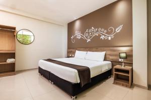Tempat tidur dalam kamar di Hotel Solec Piura