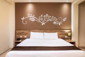 Tempat tidur dalam kamar di Hotel Solec Piura