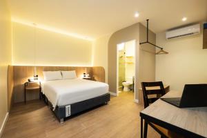 Tempat tidur dalam kamar di Hotel Solec Piura