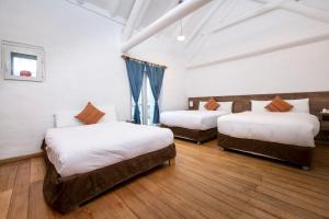 A bed or beds in a room at Inkarri Cusco