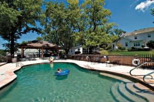 a swimming pool with a person in the water at Cedar Creek in New Haven