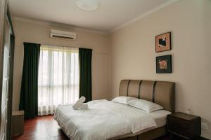 Postel nebo postele na pokoji v ubytování Gee homestay + 37 fotografií