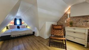 En eller flere senge i et værelse på Lazy-Oyster-Sylt