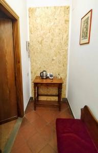 a room with a table in the corner of a room at Casal de' nonni in Campi Bisenzio