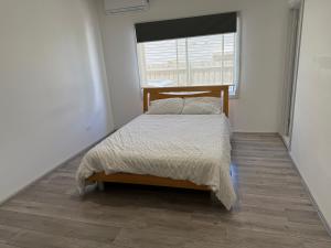 Ένα ή περισσότερα κρεβάτια σε δωμάτιο στο 1 Bedroom Entire House