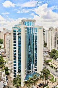 a tall building in a city with buildings at Hotel São Paulo - Premium Experience - Ibirapuera - Moema District in Sao Paulo +18 photos