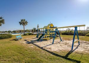 a playground with a slide and a bench in a park at The Oyster's Pearl - Wonderful Views in Harbour Key in Fripp Island