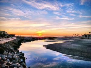 a view of a river with the sunset in the background at Walk to the Beach Balcony Sunset Ocean Views in Oceanside