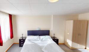 Rúm í herbergi á Boutique Hotel & Restaurant Bären Ringgenberg