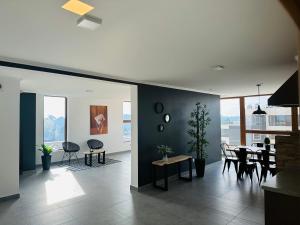 a living room with a table and chairs and a dining room at Laguna verde in Los Ángeles +10 photos