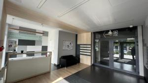 a lobby of an office building with a glass door at Kompozytor in Lublin