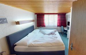 Rúm í herbergi á Boutique Hotel & Restaurant Bären Ringgenberg