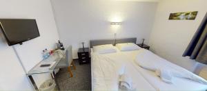 Rúm í herbergi á Boutique Hotel & Restaurant Bären Ringgenberg