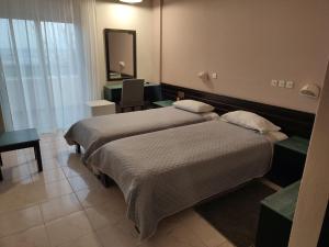 Postel nebo postele na pokoji v ubytování Plaza Hotel